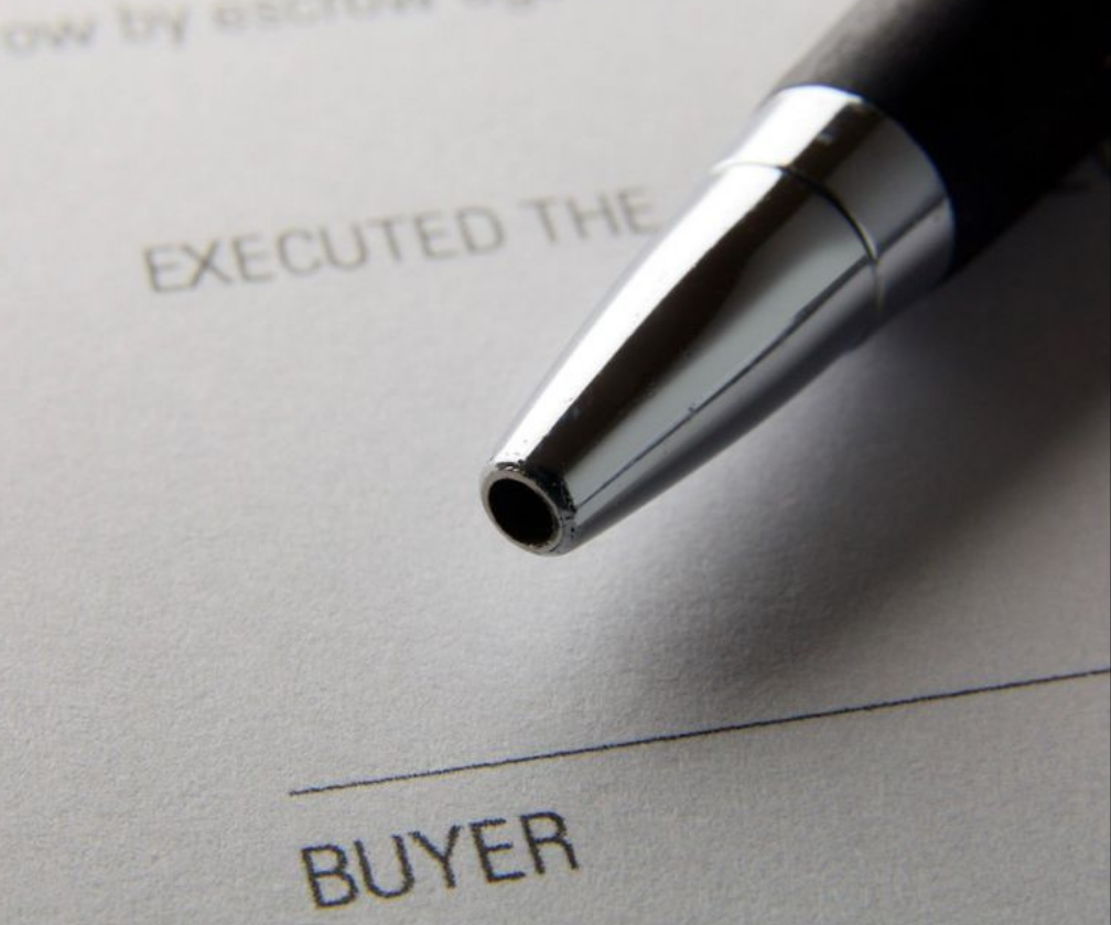 Signing a contract with a pen